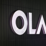 Ola Electric scooter lineup with company logo and EV manufacturing facility